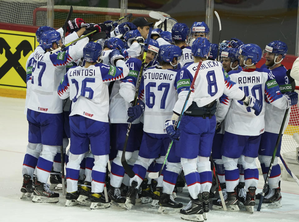 Players of Slovakia team celebrate during the Ice Hockey World Championship group A match between the Denmark and Slovakia at the Olympic Sports Center in Riga, Latvia, Saturday, May 29, 2021. (AP Photo/Oksana Dzadan)