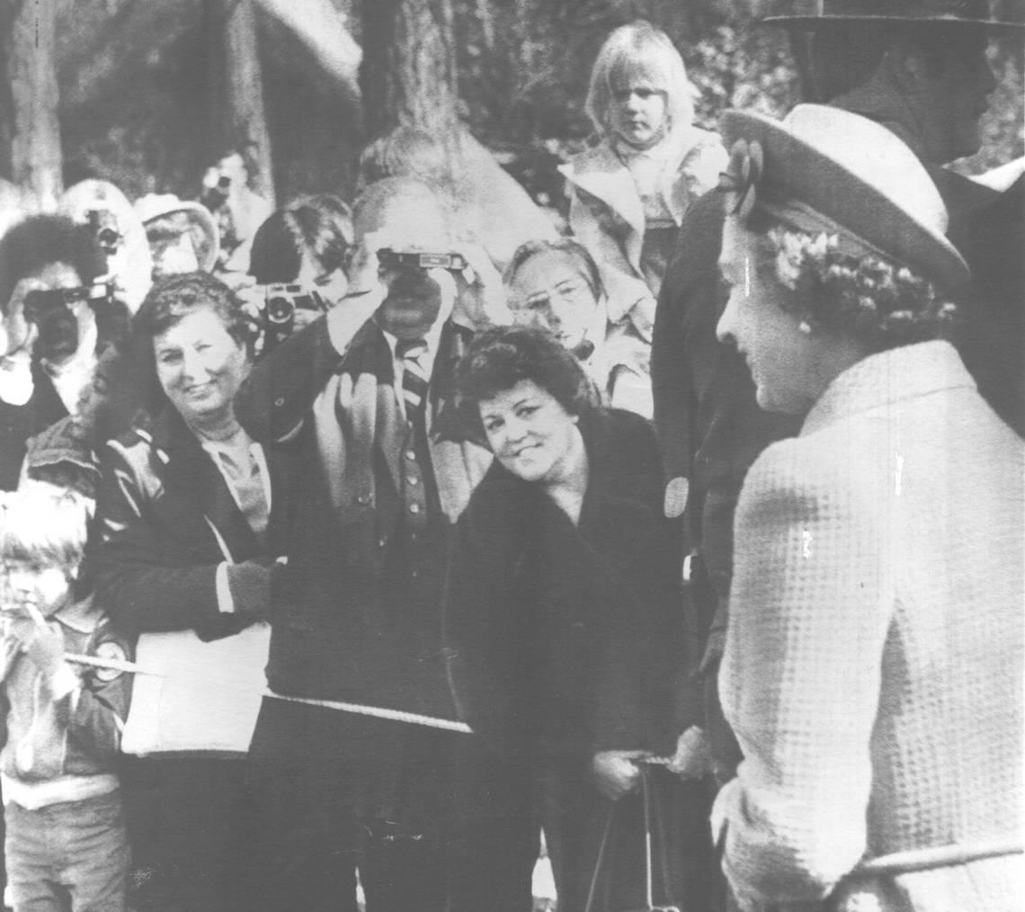 Queen Elizabeth II faces an eager horde of park visitors and their cameras during her 1983 visit to Yosemite National Park. Fresno Bee archive