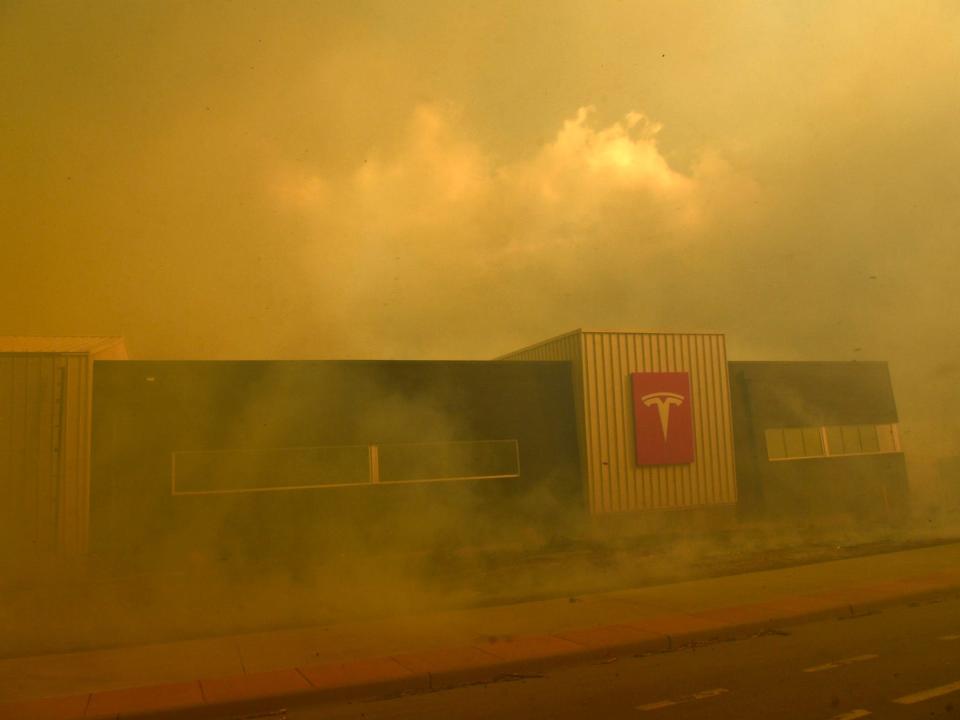 Fires burn near a Tesla dealership in Colorado.