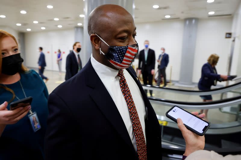 FILE PHOTO: U.S. Senator Scott speaks with reporters as he transits the subway system beneath the U.S. Capitol in Washington