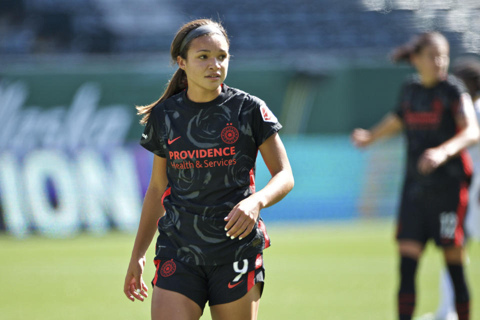 In this photo provided by the Portland Thorns, Portland Thorns' Sophia Smith looks on during an NWSL soccer match against Utah on Sunday, Sept. 20, 2020, in Portland, Ore. The No. 1 pick in the National Women's Soccer League draft and U.S. national team prospect, Smith comes from a family of basketball players — and it was just assumed she'd head in the same direction. Turned out Smith was right to choose soccer. It paved her way to Stanford, and now to a career in the NWSL. (Craig Mitchelldyer/Portland Thorns via AP)