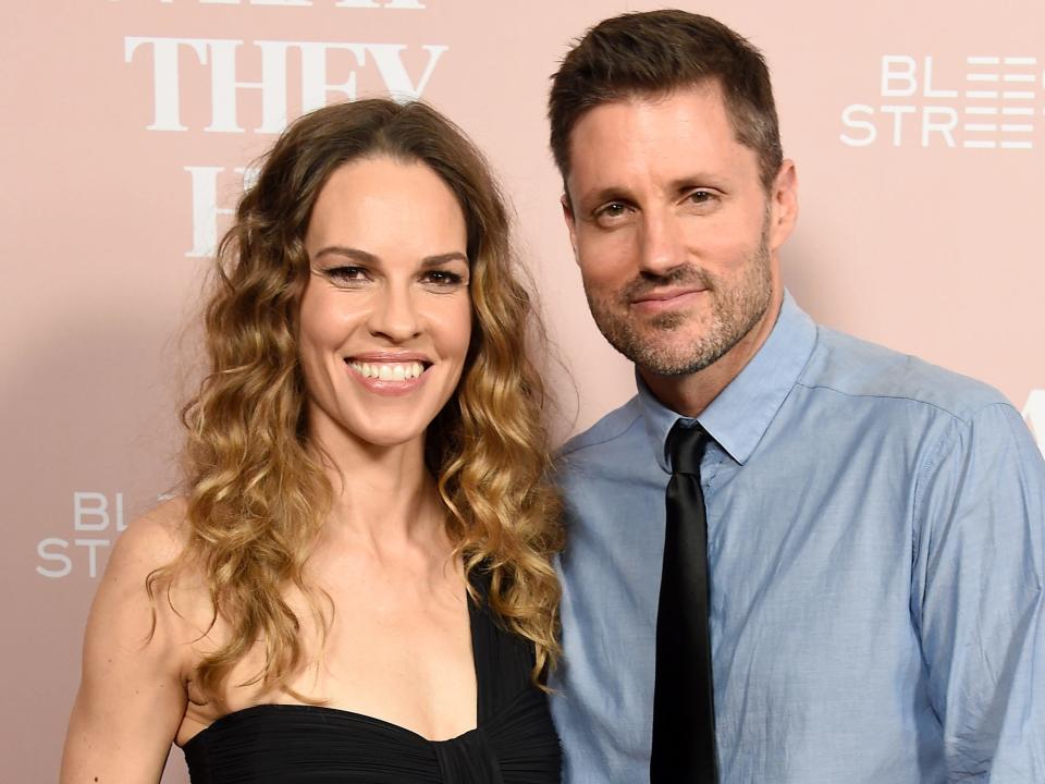 Hilary Swank and husband Philip Schneider arrive at the Los Angeles Special Screening Of "What They Had" at iPic Westwood on October 9, 2018
