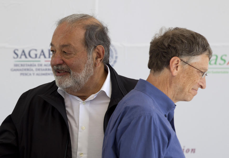 Microsoft Chairman Bill Gates, right, and Mexican telecommunications tycoon Carlos Slim attend the inauguration of a new research center at the International Center for Improvement of Corn and Wheat (CIMMYT) in Texcoco, Mexico, Wednesday, Feb. 13, 2013. Gates and Slim teamed up to to fund the seed breeding research complex, which the CIMMYT says aims to sustainably increase the productivity of maize and wheat systems to ensure global food security and reduce poverty. (AP Photo/Eduardo Verdugo)