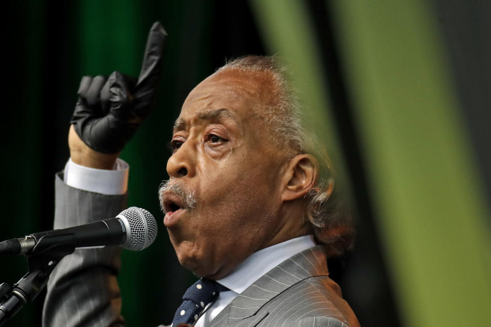 FILE - In this June 19, 2020 file photo, the Rev. Al Sharpton addresses the crowd at a Juneteenth rally in Tulsa, Okla. A national commemoration of the 1963 civil rights March on Washington is being reconfigured to comply with coronavirus protocols in the District of Columbia. This comes amid widespread protests and unrest over the police killings of Black Americans. Although many marchers will arrive via charter buses from surrounding communities on Aug. 28, the Rev. Al Sharpton will ask others to join satellite marches in states that are considered hot spots for COVID-19. (AP Photo/Charlie Riedel)