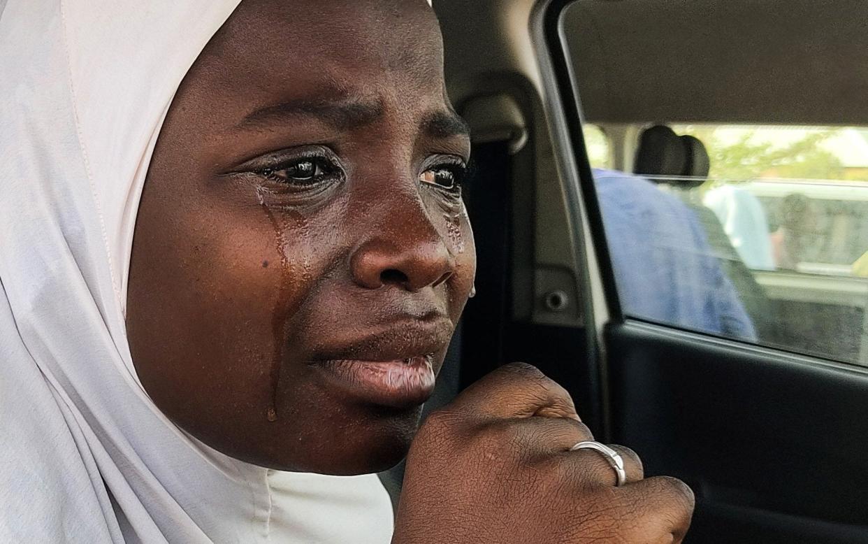 A girl prepares to reunite with family members after being kidnapped from a boarding school in northwestern Nigeria - AMINU ABUBAKAR/AFP