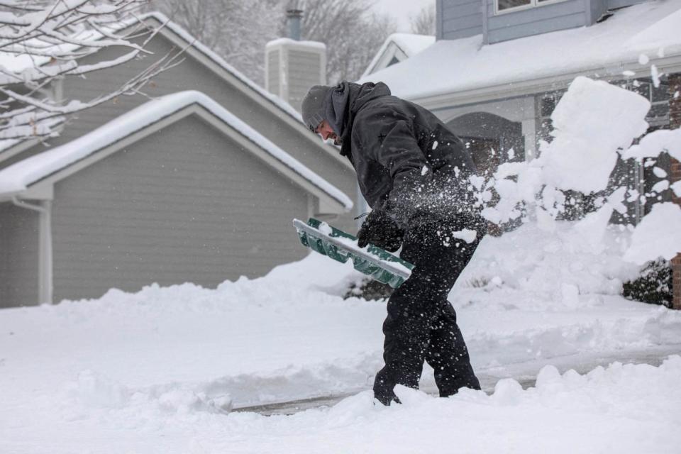 PHOTO: Zach Brobst shovels in his driveway after a snowstorm left several inches of snow in Clive, Iowa, January 9, 2024. (Alyssa Pointer/Reuters)