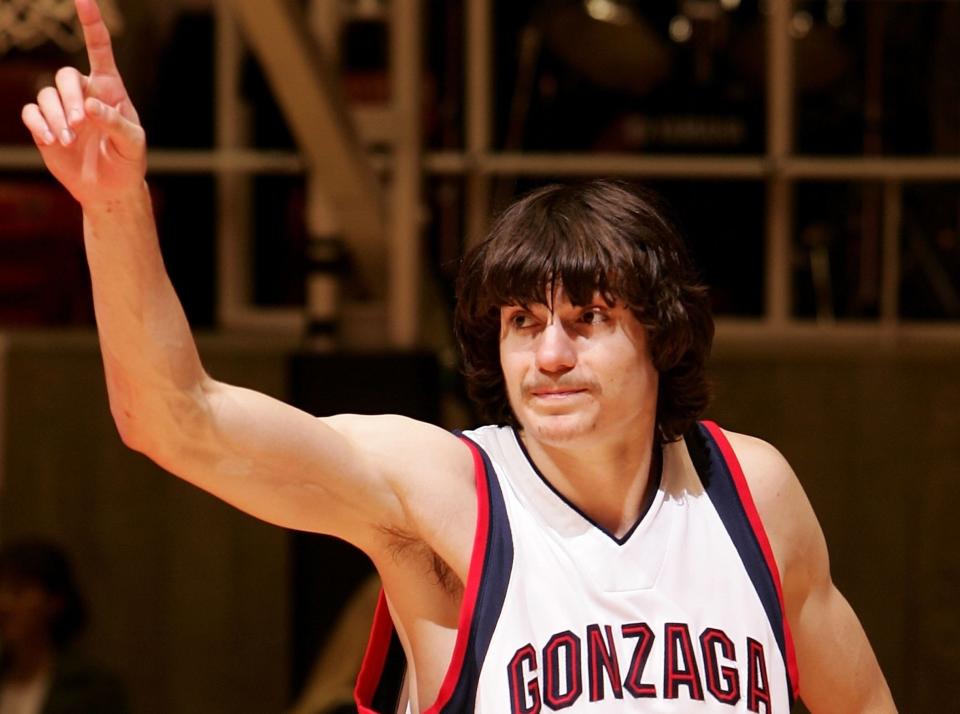 Adam Morrison holds his finger up