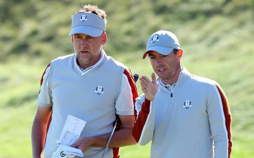  Ian Poulter of England and team Europe (L) Rory McIlroy of Northern Ireland and team Europe line up a putt on the seventh green during Saturday Afternoon Fourball Matches of the 43rd Ryder Cup at Whistling Straits on September 25, 2021 in Kohler, Wisconsin - Rory McIlroy: 'Ian Poulter was wrong to take DP World Tour to court to play in Scottish Open' - GETTY IMAGES