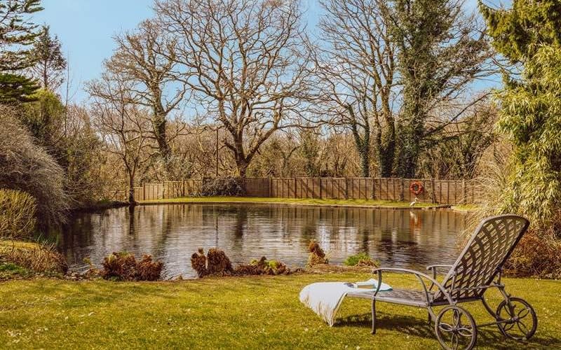 Enjoy a lake in the grounds on The Granary at Polwrath - Classic Cottages