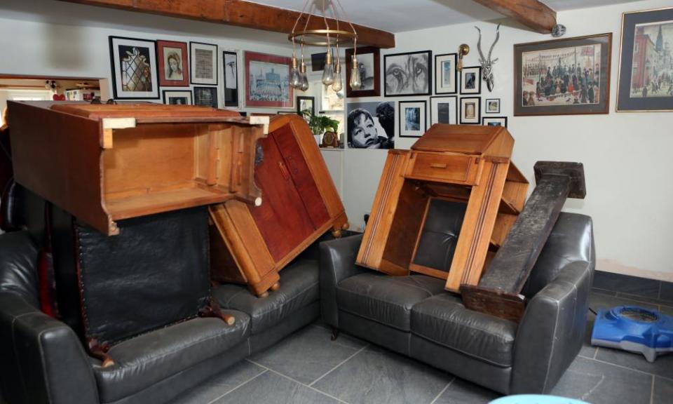 Furniture stacked high to dry out after flooding at Carla Welch’s home in Todmorden.