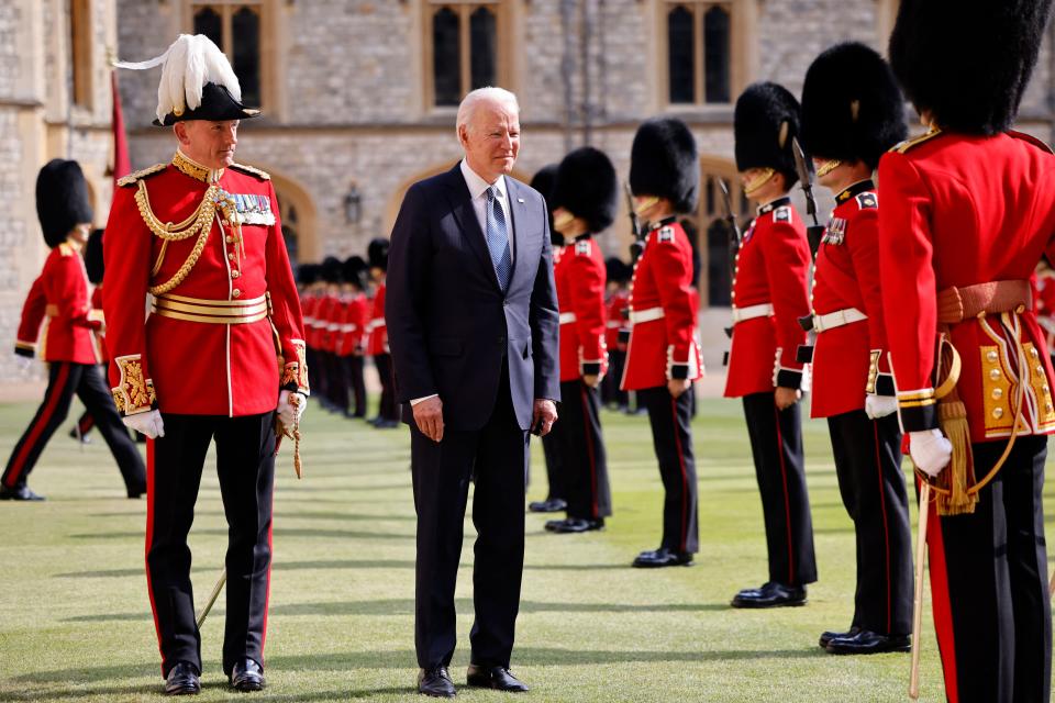 US President Joe Biden (C) joins the Major General Christopher Ghika (L) in inspecting the Guard of Honour formed of The Queen's Company First Battalion Grenadier Guards at Windsor Castle in Windsor, west of London, on June 13, 2021. - US president Biden will visit Windsor Castle late Sunday, where he and First Lady Jill Biden will take tea with the queen. (Photo by Tolga Akmen / AFP) (Photo by TOLGA AKMEN/AFP via Getty Images)
