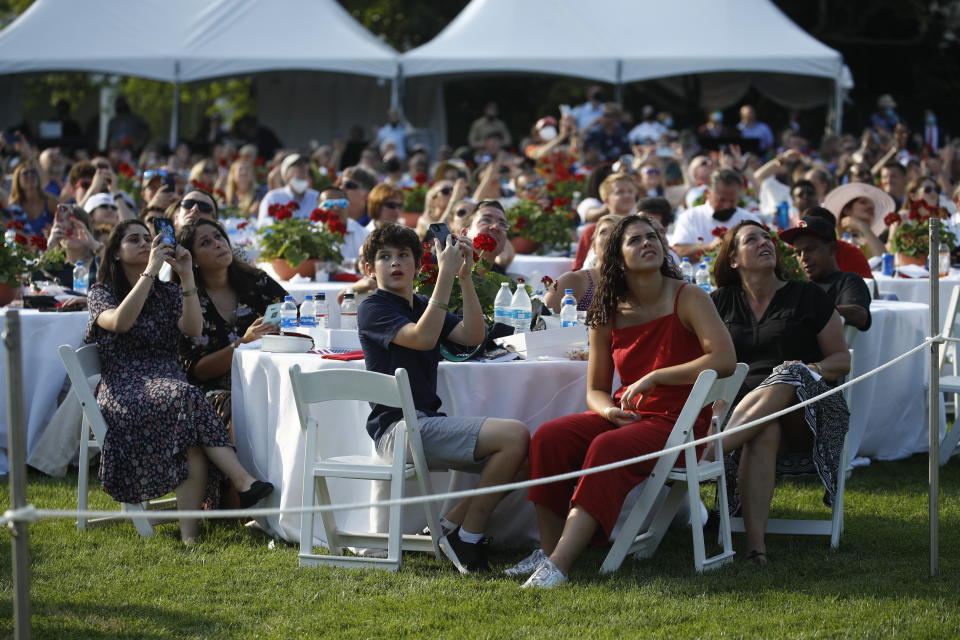 Guests wait for a "Salute to America" event to start with President Donald Trump and first lady Melania Trump on the South Lawn of the White House, Saturday, July 4, 2020, in Washington. (AP Photo/Patrick Semansky)