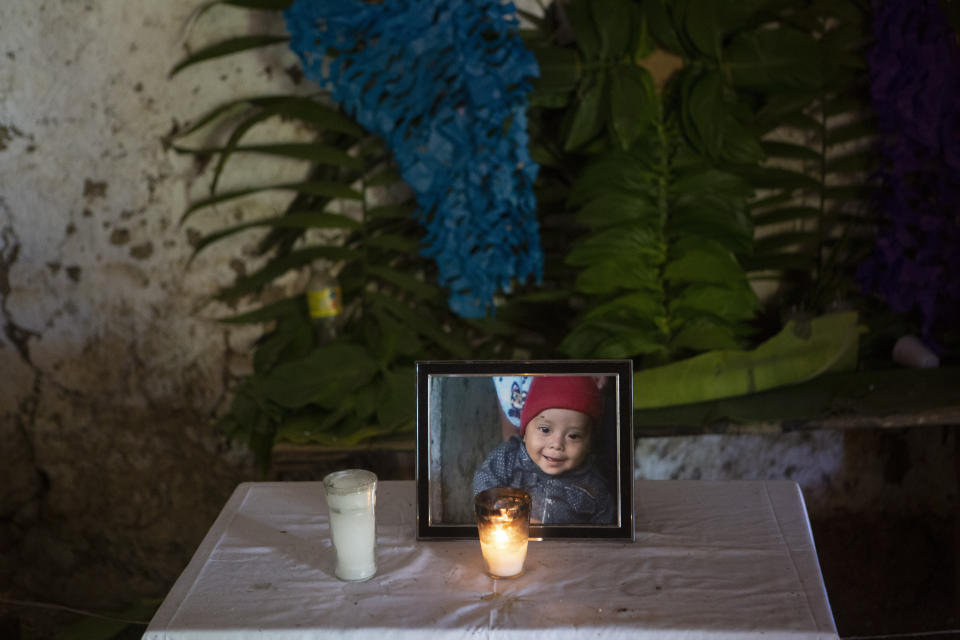 In this May 30, 2019 photo, a portrait of Wilmer Josué Ramírez Vásquez, a 2-year-old Guatemalan boy who died in U.S. custody on May 14, stands on an altar at his grandmother's home in Tituque village, in the Olopa municipality of eastern Guatemala. Wilmer and his mother Hilda left home in March and took 22 days to make the journey to the U.S. during when he became ill in Mexico and crossed into the United States with a high fever and difficulty breathing. Diagnosed with pneumonia at a children's hospital, Wilmer died about a month later. (AP Photo/Moises Castillo)