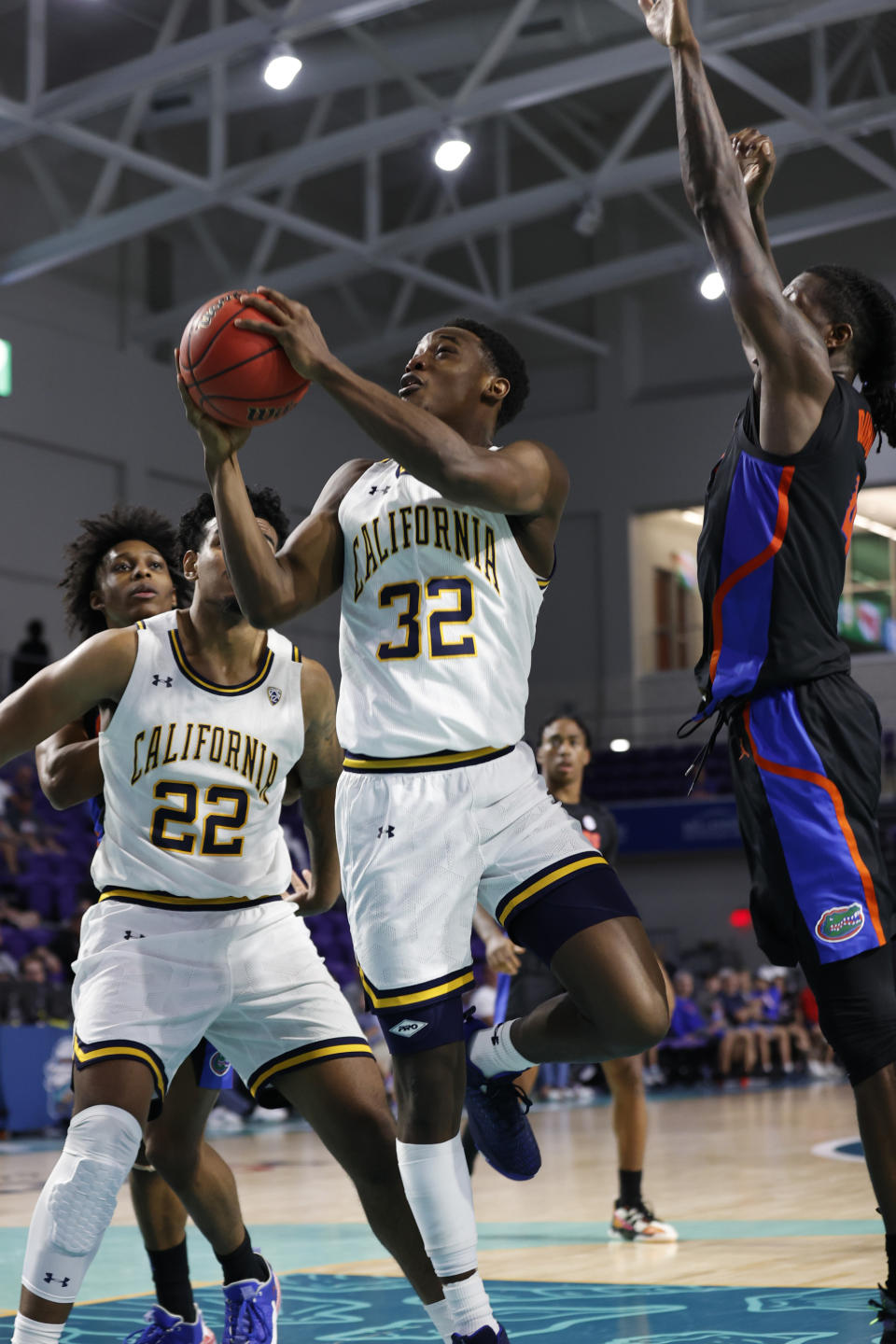 California guard Jalen Celestine (32) drives to the basket against Florida during the second half of an NCAA college basketball game on Monday, Nov. 22, 2021, in Fort Myers, Fla. (AP Photo/Scott Audette)