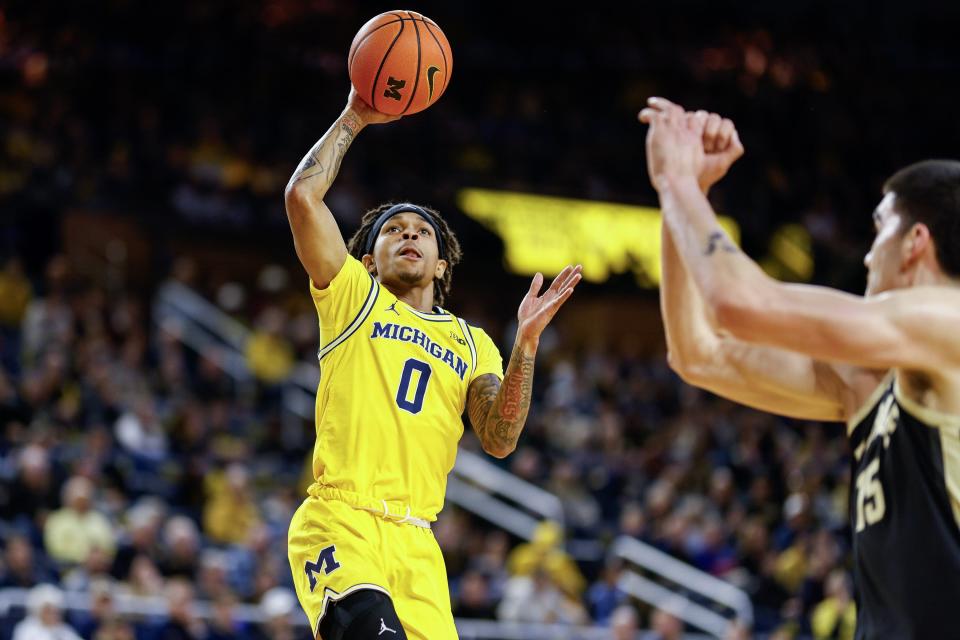 Dug McDaniel of the Michigan Wolverines goes up for a layup in the first half of a game against the Purdue Boilermakers at Crisler Arena on Sunday, Feb. 25, 2024, in Ann Arbor, Michigan.