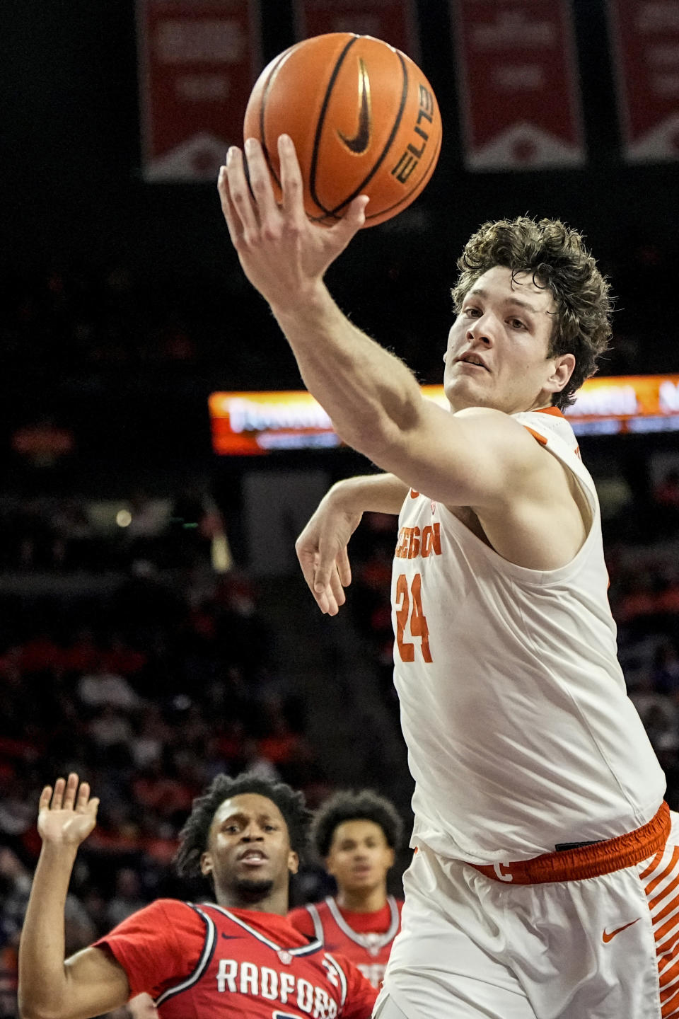 Clemson center PJ Hall (24) tries to catch the ball against the Radford during the first half of an NCAA college basketball game, Friday, Dec. 29, 2023, in Clemson, S.C. (AP Photo/Mike Stewart)