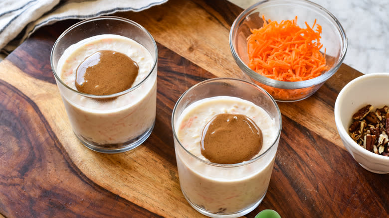 carrot cake overnight oats in glasses with almond butter