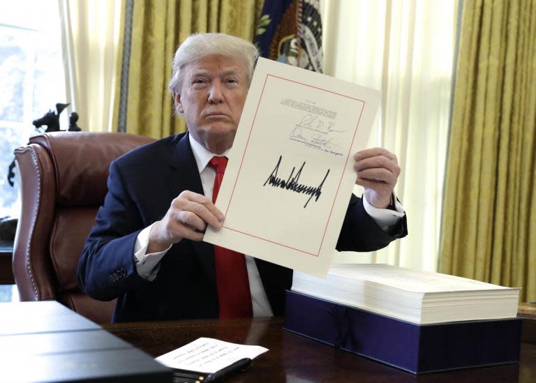 Donald Trump signs $1.5 trillion tax bill into law