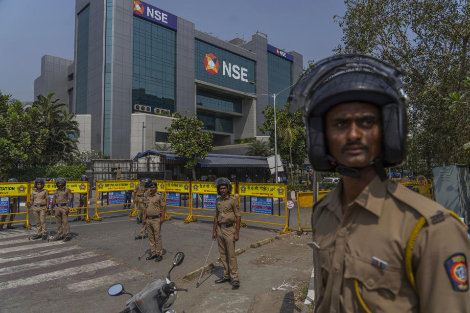 Policemen stand guard outside National Stock Exchange during a protest by opposition Congress party in Mumbai, India, Wednesday, March 1, 2023. The Adani Group suffered a massive sell-off of its shares after a U.S.-based short-selling firm, Hindenburg Research, accused it of various fraudulent practices. The Adani Group has denied any wrongdoing. (AP Photo/Rafiq Maqbool)