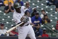 Milwaukee Brewers' Lorenzo Cain hits a two-run scoring single during the seventh inning of a baseball game against the Atlanta Braves Sunday, May 16, 2021, in Milwaukee. (AP Photo/Morry Gash)