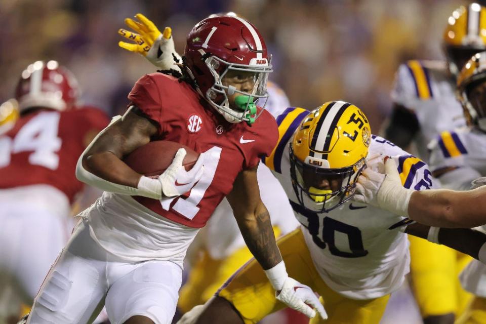 Alabama's Jahmyr Gibbs runs with the ball as LSU's Greg Penn III defends during the first half at Tiger Stadium on Nov. 5, 2022 in Baton Rouge, Louisiana.