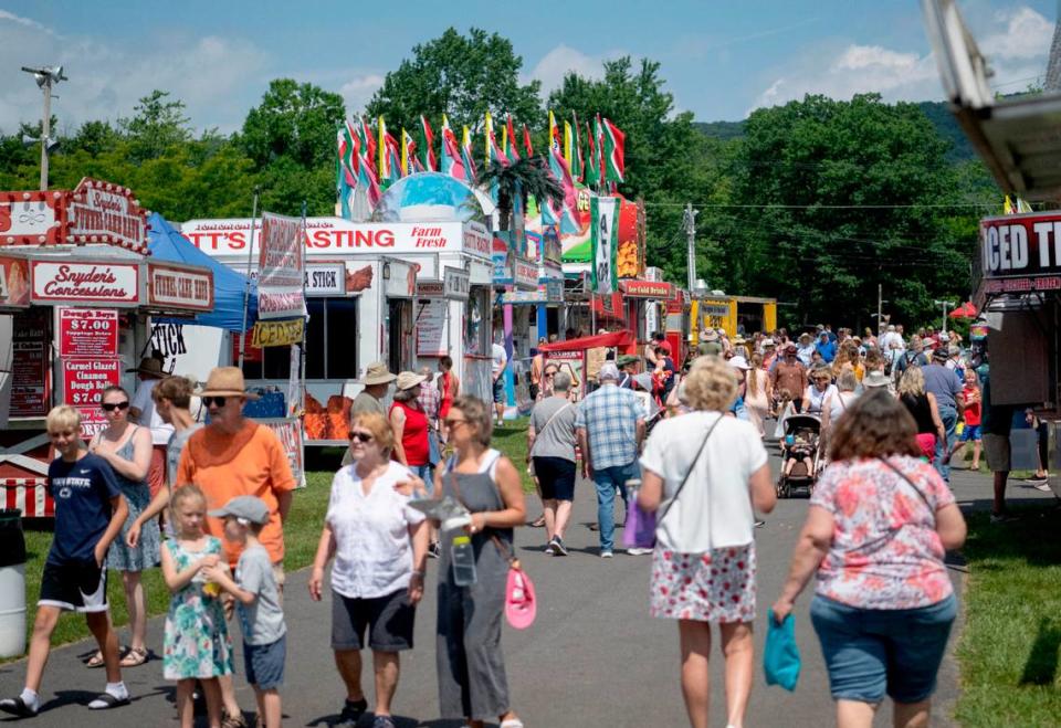 Guests browse the food options at the People’s Choice Festival on Friday, July 14, 2023.