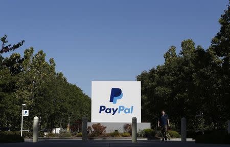 A PayPal sign is seen at an office building in San Jose, California May 28, 2014. REUTERS/Beck Diefenbach