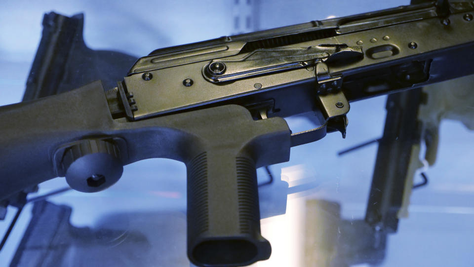 FILE - A bump stock is attached to a semi-automatic rifle at The Gun Vault in South Jordan, Utah, Oct. 4, 2017. The U.S. Supreme Court, Friday, June 14, 2024, struck down a ban on the rapid-fire rifle bump stock used by the gunman who rattled off over 1,000 bullets in 11 minutes in Las Vegas in 2017. (AP Photo/Rick Bowmer, File)