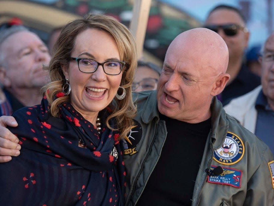 Mark Kelly and Gabrielle Giffords celebrate Kelly's win in the 2022 midterms