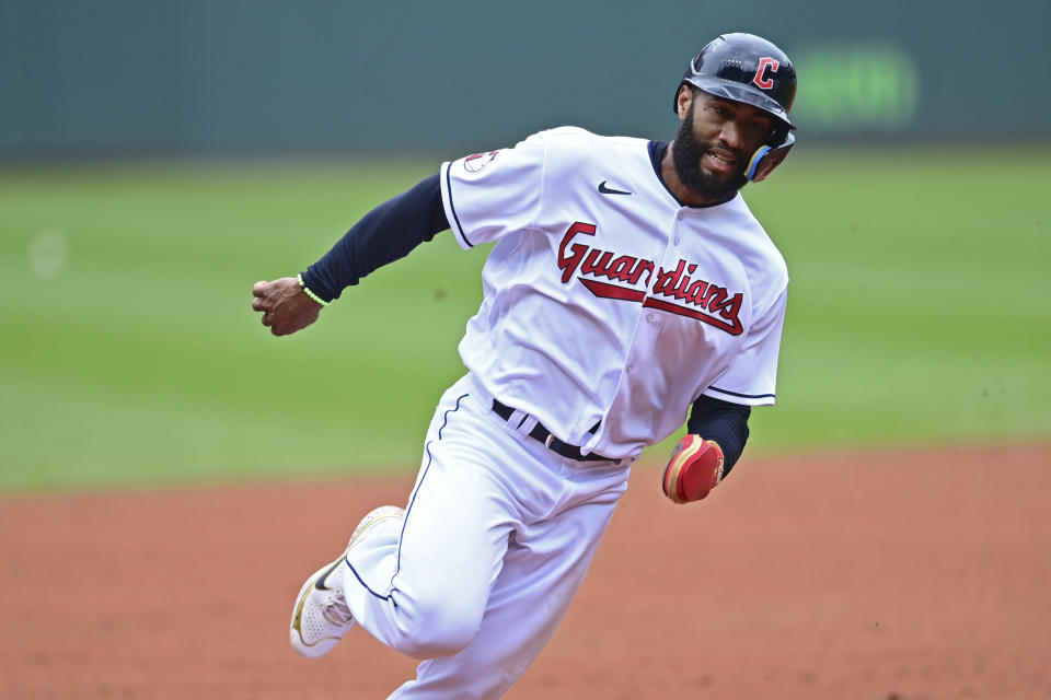 Cleveland Guardians' Amed Rosario rounds third on the way to scoring on an RBI-single by Owen Miller in the first inning of a baseball game against the Detroit Tigers, Sunday, May 22, 2022, in Cleveland. (AP Photo/David Dermer)