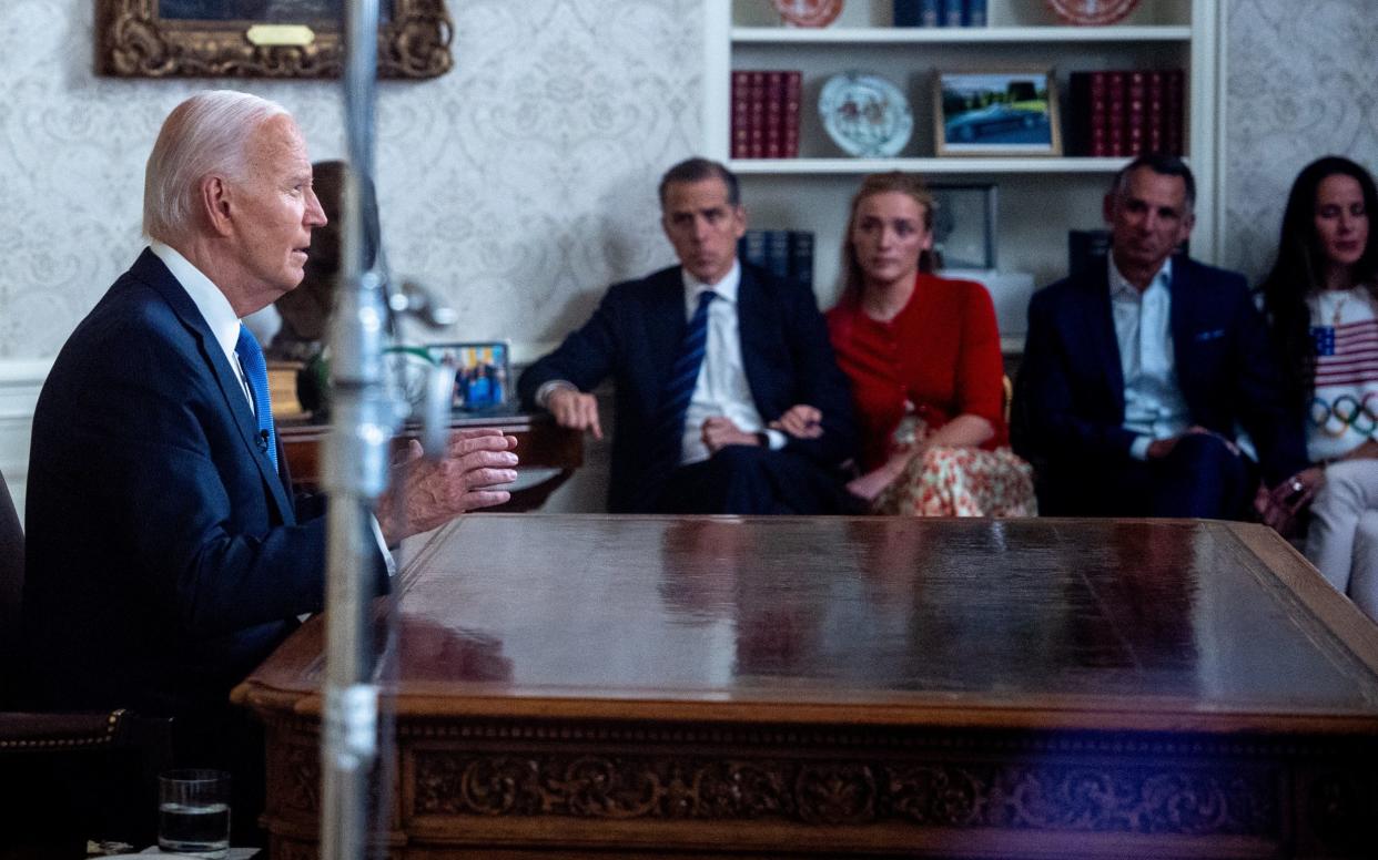 Mr Biden's family watched on as he gave his address