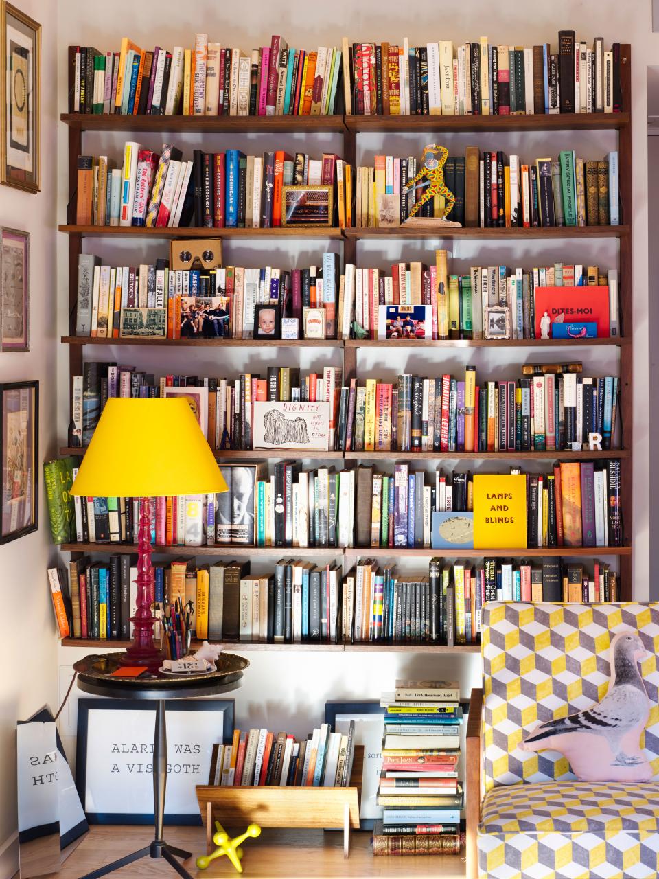 3. LAYER, LAYER, AND THEN KEEP LAYERING: Even brimming with books, these shelves by Herman Miller (bought by Annie’s parents in the 1970s) serve as display cases for additional photos and cards, which are propped up for easy swapping in and out.