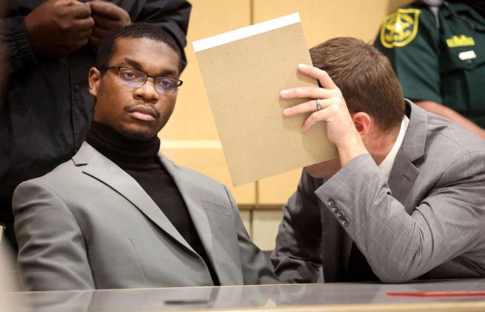 Michael Boatwright listens to his attorney Joseph Kimok after he was found guilty of first-degree murder of emerging rapper XXXTentacion at the Broward County Courthouse in Fort Lauderdale on Monday, March 20, 2023.