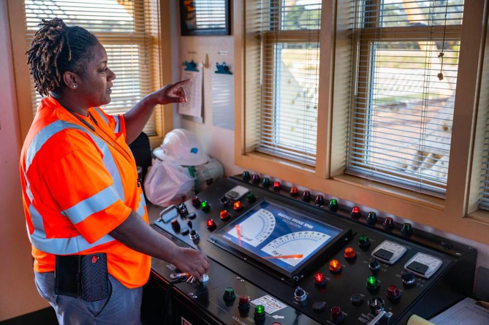 Drawbridge operator Latasha Carrie explains how she uses the control panel for the Isleton Bridge to raise the bridge for boat traffic during her shift on Friday.