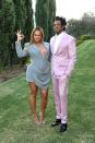 <p> Opting for a tailored blue dress - complete with corset detailing, a low cut v-neckline and dramatic shoulder pads - Beyoncé posed alongside her husband, Jay-Z at the 2020 Roc Nation brunch. She accessorised with a pair of silver statement earrings, silver strappy heels and bared her totally toned legs, wearing her straight hair in a slick middle parting.  </p>