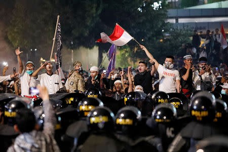 People shout during a protest outside the Election Supervisory Agency (Bawaslu) headquarters following the announcement of the last month's presidential election results in Jakarta, Indonesia, May 22, 2019. REUTERS/Willy Kurniawan