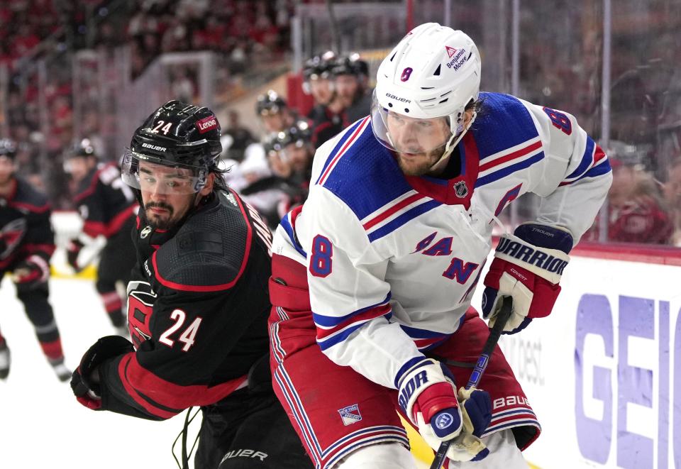RALEIGH, NORTH CAROLINA - MAY 16: Jacob Trouba #8 of the New York Rangers battles with Seth Jarvis #24 of the Carolina Hurricanes during the second period in Game Six of the Second Round of the 2024 Stanley Cup Playoffs at PNC Arena on May 16, 2024 in Raleigh, North Carolina.