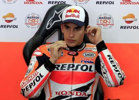 Honda MotoGP rider Marc Marquez of Spain prepares for the third free practice session ahead of the Valencia Motorcycle Grand Prix at the Ricardo Tormo racetrack in Cheste, near Valencia, November 8, 2014. REUTERS/Heino Kalis