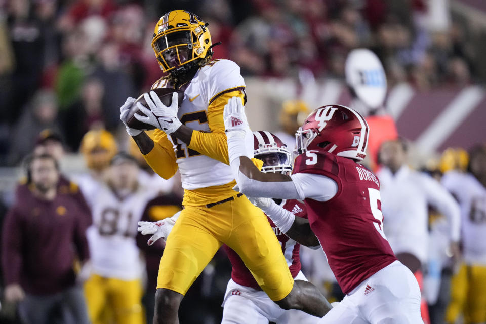 Minnesota wide receiver Dylan Wright (16) pulls in a pass in front of Indiana defensive back Juwan Burgess (5) in the second half during an NCAA college football game in Bloomington, Ind., Saturday, Nov. 20, 2021. (AP Photo/AJ Mast)