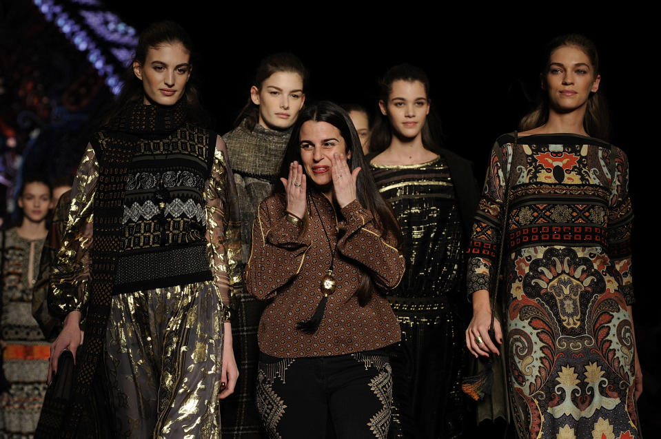 Italian fashion designer Veronica Etro (center) acknowledges the applauses at the end of her women's Fall-Winter 2014-15 collection, part of the Milan Fashion Week, unveiled in Milan, Italy, Friday, Feb. 21, 2014. (AP Photo/Giuseppe Aresu)