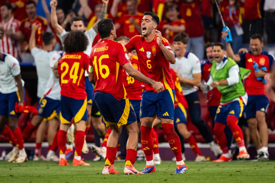 MUNICH, GERMANY - JULY 09: Rodri and Mikel Merino (L-R) of Spain celebrate victory after the UEFA EURO 2024 semi-final match between Spain v France at Munich Football Arena on July 09, 2024 in Munich, Germany. (Photo by Marvin Ibo Guengoer - GES Sportfoto/Getty Images)