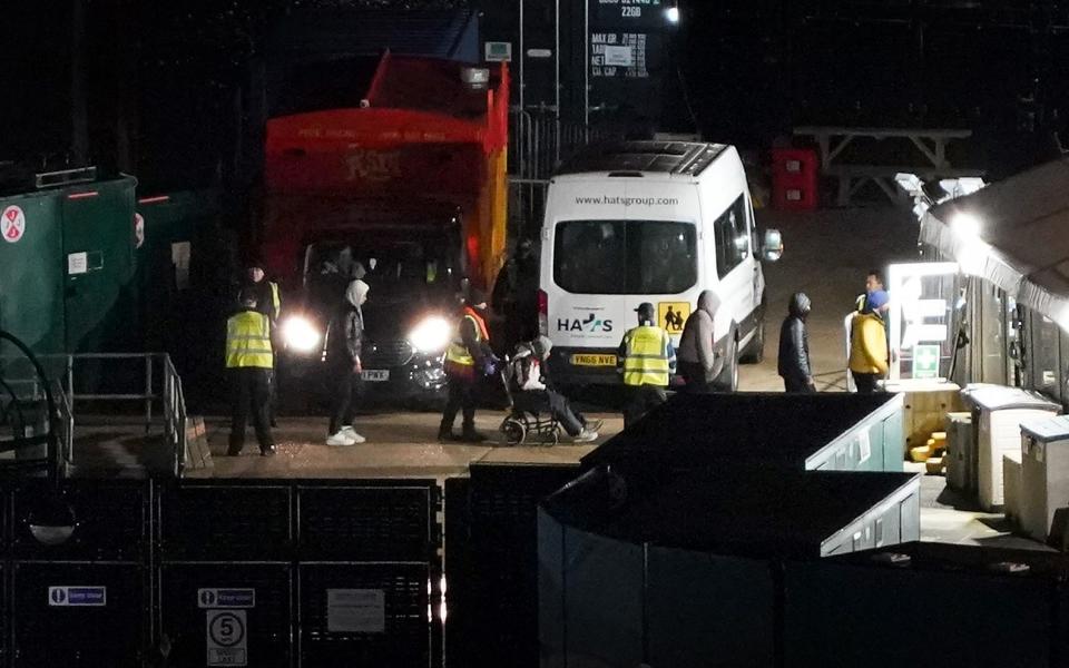 People thought to be migrants are brought off a Border Force vessel in Dover