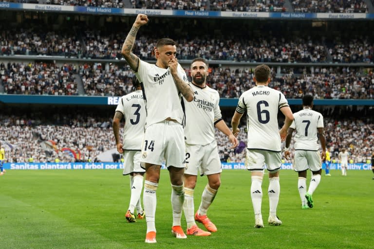 <a class="link " href="https://sports.yahoo.com/soccer/teams/real-madrid/" data-i13n="sec:content-canvas;subsec:anchor_text;elm:context_link" data-ylk="slk:Real Madrid;sec:content-canvas;subsec:anchor_text;elm:context_link;itc:0">Real Madrid</a> wrapped up the Spanish title with a 3-0 win over <a class="link " href="https://sports.yahoo.com/soccer/teams/cadiz/" data-i13n="sec:content-canvas;subsec:anchor_text;elm:context_link" data-ylk="slk:Cadiz;sec:content-canvas;subsec:anchor_text;elm:context_link;itc:0">Cadiz</a> and <a class="link " href="https://sports.yahoo.com/soccer/teams/barcelona/" data-i13n="sec:content-canvas;subsec:anchor_text;elm:context_link" data-ylk="slk:Barcelona;sec:content-canvas;subsec:anchor_text;elm:context_link;itc:0">Barcelona</a>'s subsequent defeat at <a class="link " href="https://sports.yahoo.com/soccer/teams/girona/" data-i13n="sec:content-canvas;subsec:anchor_text;elm:context_link" data-ylk="slk:Girona;sec:content-canvas;subsec:anchor_text;elm:context_link;itc:0">Girona</a> (OSCAR DEL POZO)