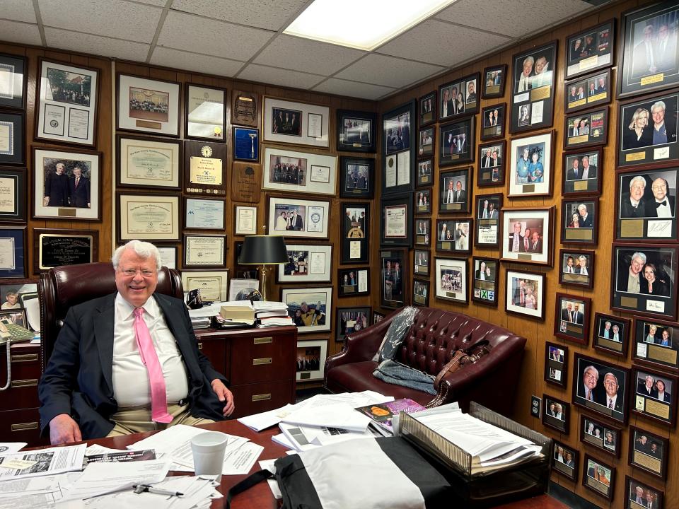 Municipal Judge John Rosson Jr. is surrounded by photos of political figures, entertainers and media personalities at his office in the Safety Building on May 23.