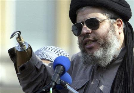 Muslim cleric, Abu Hamza al-Masri, is seen addressing the sixth annual rally for Islam in Trafalgar Square, London in this August 25, 2002 file photograph. REUTERS/Ian Waldie/Files