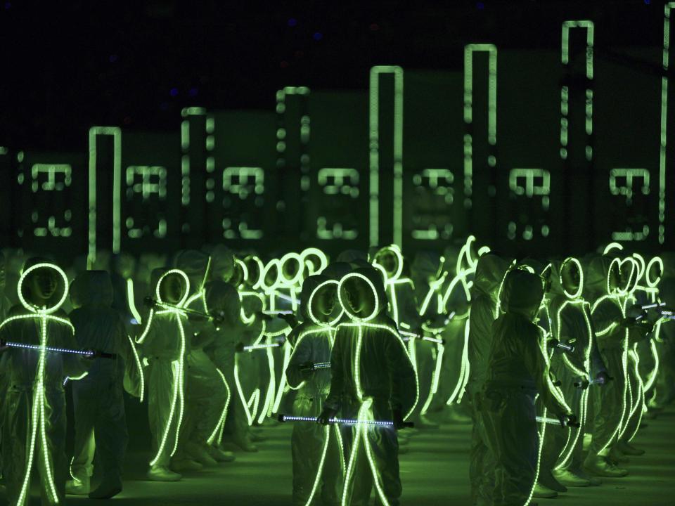 children performing in LED costumes