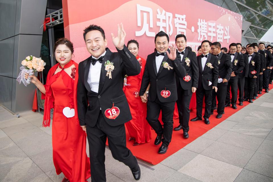 Thirty-five new couples participate in a staff group wedding held by Zhengzhou Trade Union on October 16, 2021 in Zhengzhou, Henan Province.