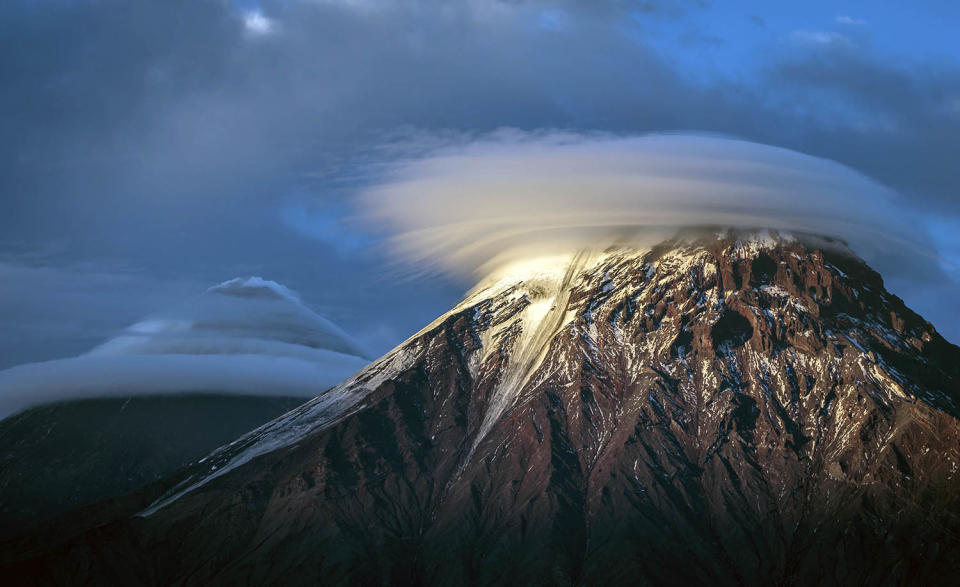 Stunning images capture ‘UFO’ clouds surrounding volcano 