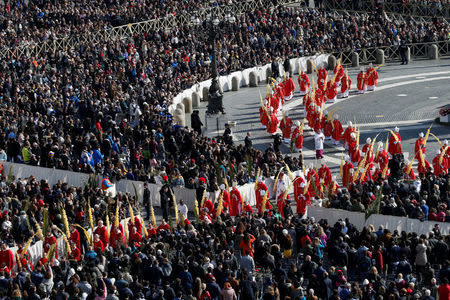 Cardinals arrive to attend the Palm Sunday Mass in Saint Peter's Square at the Vatican, March 25, 2018 REUTERS/Stefano Rellandini