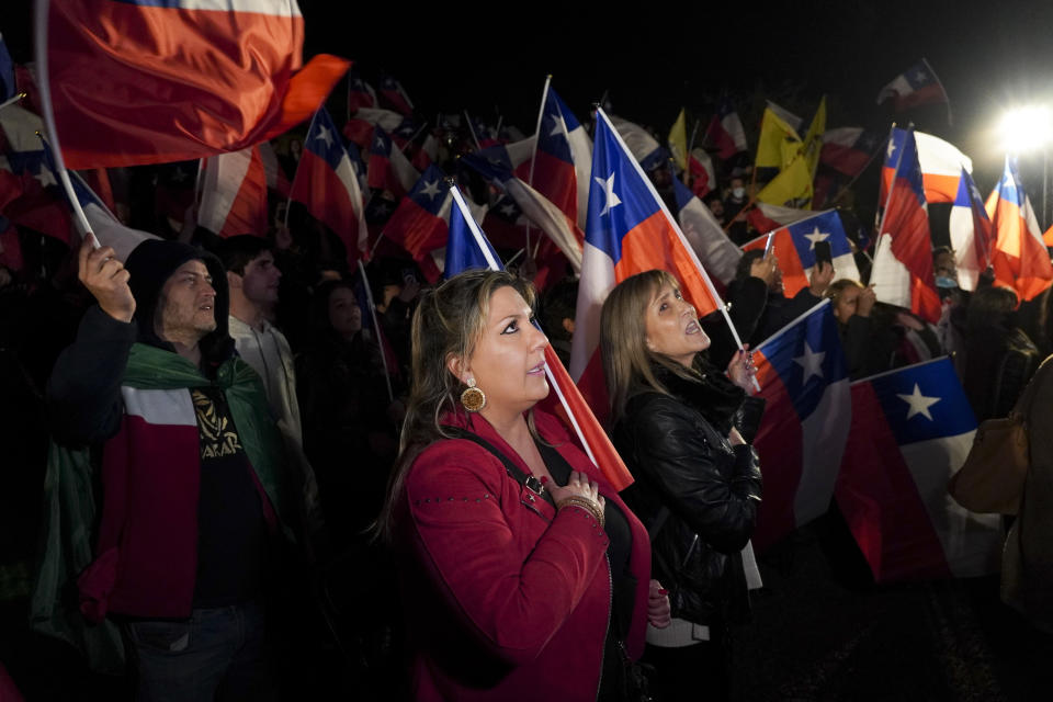 Demonstrators sing the national anthem as they rally against the new proposed Constitution in Santiago, Chile, Thursday, Sept. 1, 2022. Chileans have until the Sept. 4 plebiscite to study the new draft and decide if it will replace the current Magna Carta imposed by a military dictatorship 41 years ago. (AP Photo/Matias Basualdo)